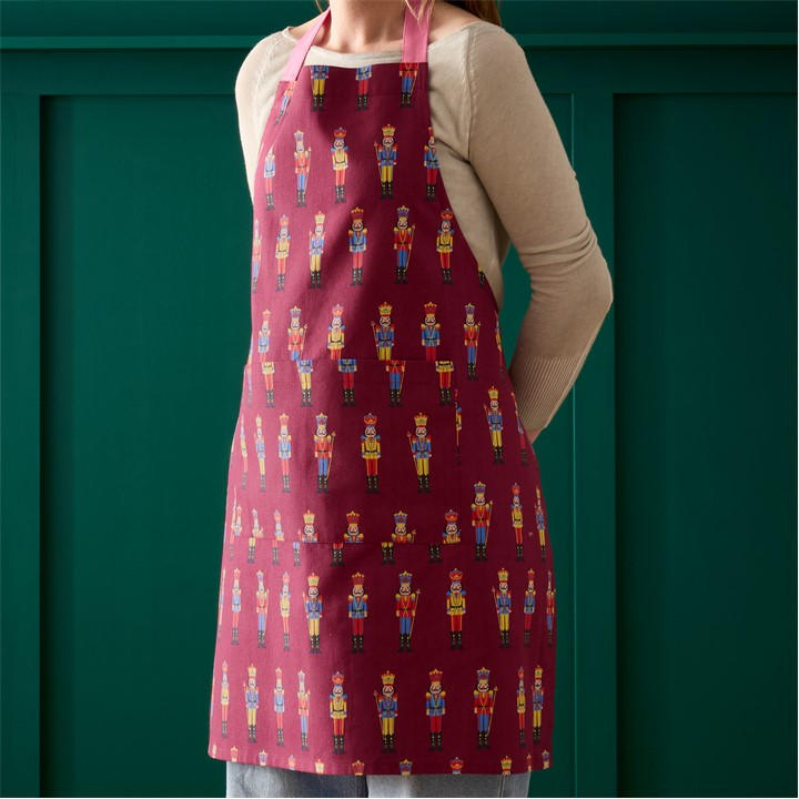 Catherine Lansfield 'Christmas Nutcracker' Cotton Kitchen Adult Apron in Plum - Image 4
